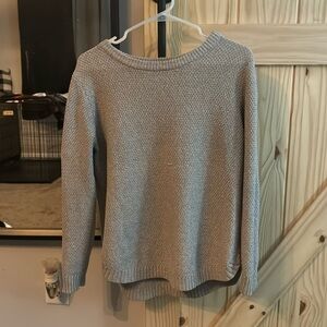 Comfortable boutique beige sweater with high low hem.